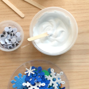 Use shaving cream and white glue to create paint, make your snowman and add scraps and found items for decorations