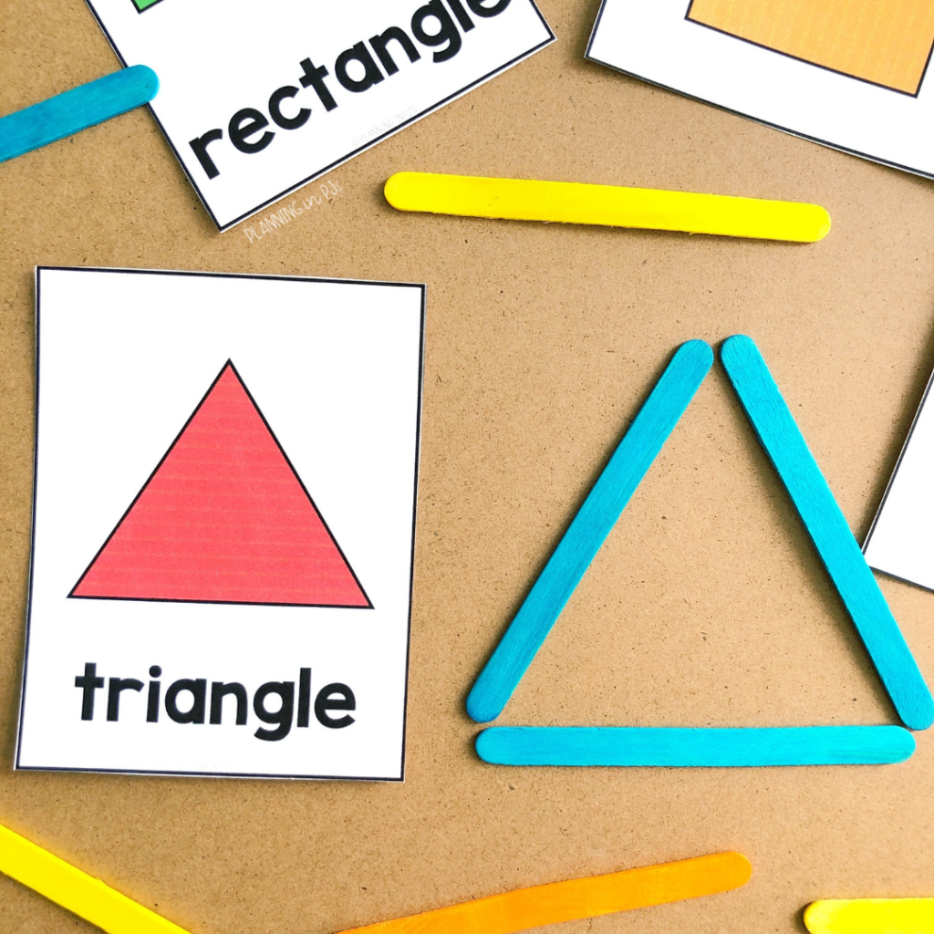 Triangle flashcard with blue popsicle sticks in a triangle shape